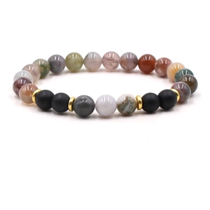 Detail of beaded bracelet featuring natural tiger eye and turquoise with gold spacers