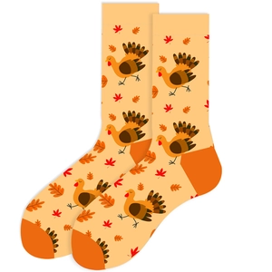Detail of orange Thanksgiving socks with cartoon turkey and autumn maple leaf patterns