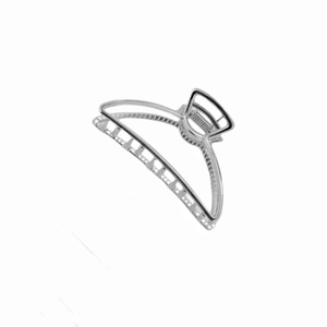 Close-up of polished silver metal half-moon hair claw clip with smooth reflective finish