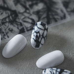 Minimalist marble and white adhesive nail art stickers with natural stone texture finish