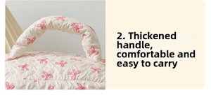 Close-up of thickened handle on quilted floral makeup bag for easy carrying