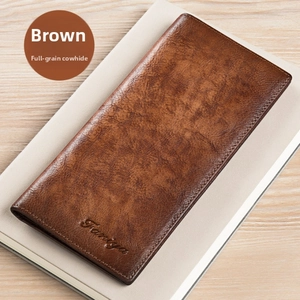 Close-up of premium brown top grain leather wallet texture with embossed brand logo