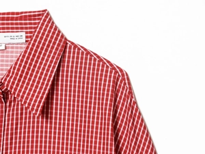 Detail of red and white gingham poplin shirt collar with size S label and stitching