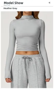 Detail of heather gray tight high-neck crop top and high-waist drawstring joggers
