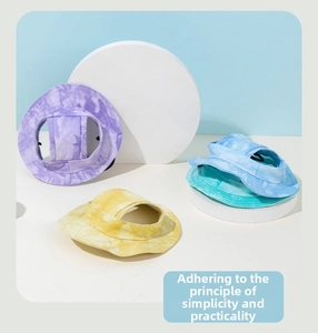 Detail of tie-dye pet sun hat with ear holes and adjustable cord for small dogs and cats