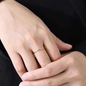 Minimalist 1mm gold stainless steel ring with colorful zircon stones on model hand