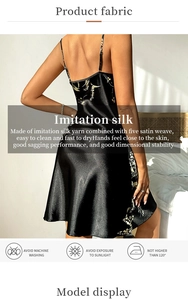 Detail of black silk satin slip dress featuring floral print and elegant open back style