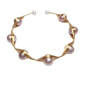 Handmade freshwater lavender pearl bracelet with 14K gold wire wrapping on white background