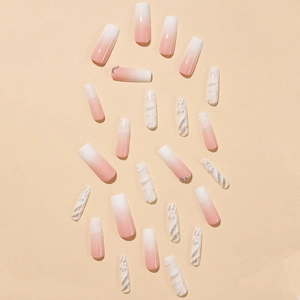 Extra-long coffin fake nails with pink gradient, white marble patterns, and rhinestones