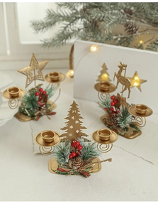 Close-up of golden Christmas candle holders with pine needles berries and pine cones