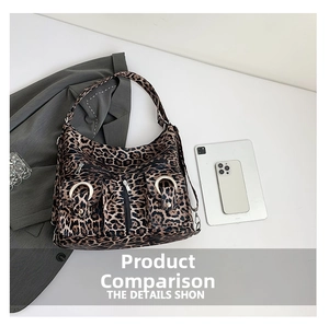 Detailed top view of leopard print hobo bag with zip pockets and metallic buckle hardware