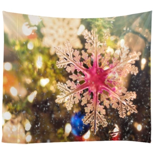 Festive Christmas tapestry featuring pink snowflake ornament and warm bokeh lighting effects