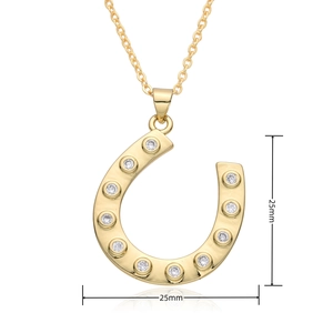 Detail view of 18k gold plated horseshoe pendant with 25mm dimensions and zircons