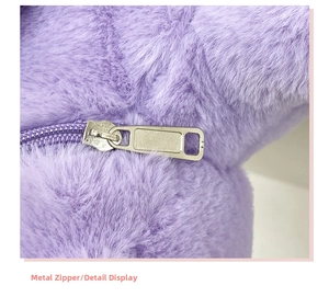 Detail view of smooth silver metal zipper on premium purple plush teddy bear backpack fabric