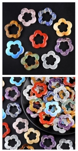 Macro detail of various colorful 30mm hollow plum blossom natural stone pendants