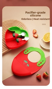 Detail of strawberry silicone baby feeding set with bib, suction plate and cutlery