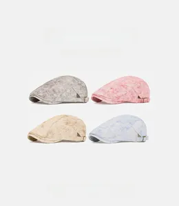 Detail of retro washed cotton newsboy caps showing adjustable buckles and vintage texture