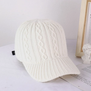 White cable-knit baseball cap for women with side label and minimalist textured design