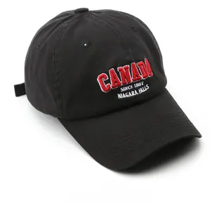 Detail of the high-quality 3D CANADA embroidery on a black washed cotton baseball cap