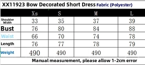 Size guide for bow short dress listing measurements in cm and polyester material detail