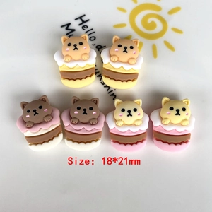 Detailed macro view of 18x21mm resin puppy cupcake charms for DIY phone cases and hair clips