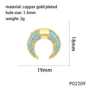 Macro detail of gold-plated crescent moon charm with blue pavé stones and precise size specs