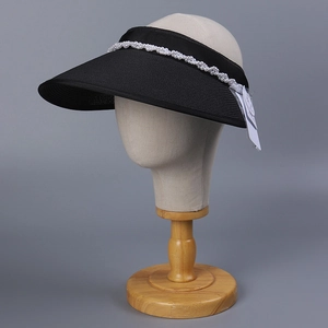 Detailed side view of an elegant black wide-brim sun visor with pearl decoration