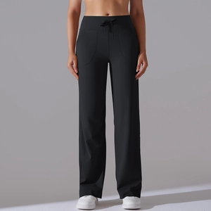 Detail of high-waist yoga pants with adjustable drawstring and side pockets