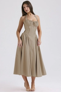 Detail view of the halter neck design and ruched corset waist on khaki summer maxi dress