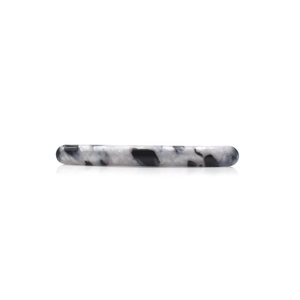 Sleek black and white acrylic spring hair clip with glossy finish on white background