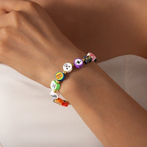 Detailed view of Halloween polymer clay bracelet with pumpkin, ghost and skull beads