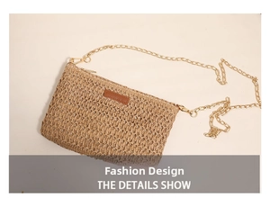 Detail of woven straw bag featuring fine golden metal chain and brown leather logo patch