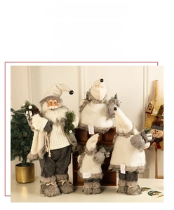 Close-up of Nordic style Christmas gnomes and Santa plush toys in grey knit textures