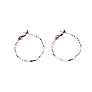 Minimalist silver hoop earrings with hammered texture and pin closure for women