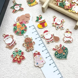 Christmas DIY alloy enamel charms featuring Santa and reindeer with ruler for size scale