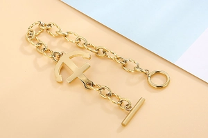 Detail of vintage gold anchor bracelet with twisted chain and toggle T-bar clasp