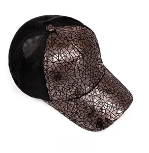 Detailed view of bronze metallic crackle texture and breathable black mesh on baseball cap