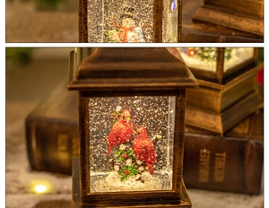 Detail of vintage Christmas lantern featuring miniature snowman and red bird inside