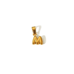 Detailed view of a 18k gold plated bubble letter M pendant with a smooth polished finish
