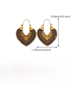 Detailed view of heart-shaped hollow earrings with blue bead accents and size dimensions