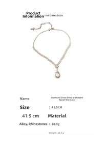 Detail view of silver V-shape water drop fringe necklace with rhinestone settings