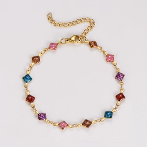 Detail of colorful glitter squares on a gold stainless steel bracelet with lobster clasp