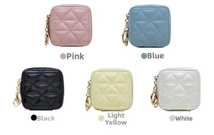 Quilted faux leather cosmetic bags in pink, blue, black, yellow and white with metal hooks