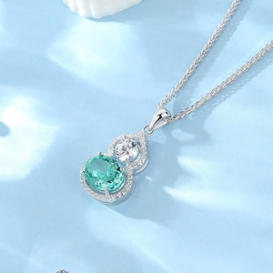 Elegant S925 silver gourd necklace with emerald green stone and sparkling zircon pendant