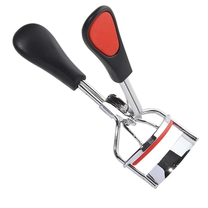 Mini stainless steel eyelash curler with ergonomic red and black handle on white background