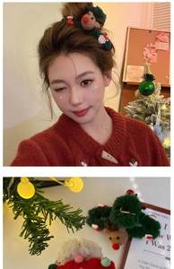 Detail of Christmas plush hair claw with reindeer and Santa Claus festive decorations