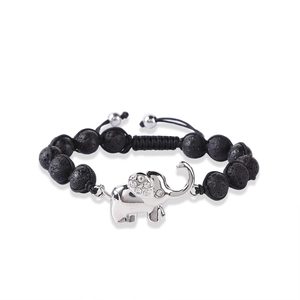 Detail of hand-woven bracelet with 8mm black lava stone beads and silver elephant charm