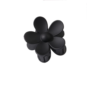 Matte black daisy flower hair claw clip with sturdy resin design and secure grip teeth