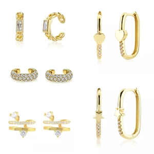 Set of gold C-shaped ear cuffs and hoop earrings with sparkling zircon stones