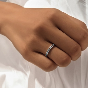 Macro view of sterling silver star ring featuring inlaid sky blue round beads for women